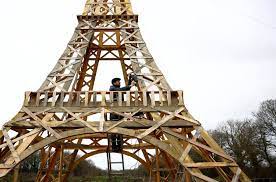 Two friends build Eiffel Tower from recycled wood ahead of Olympics