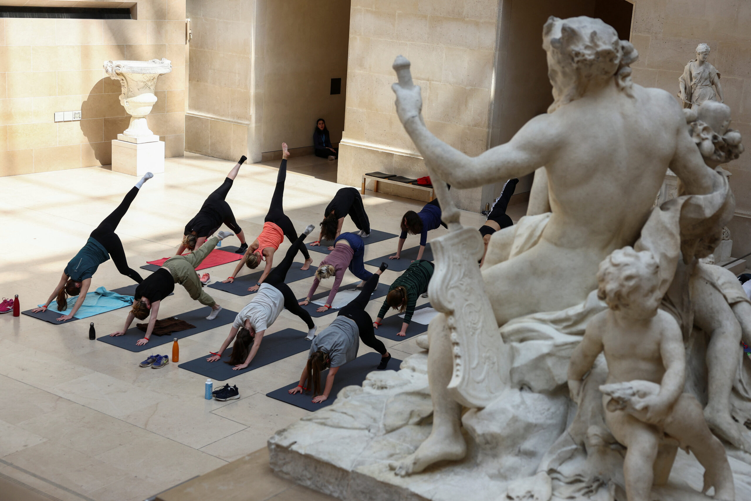 Parisians warm up for Olympics with workouts in Louvre Museum